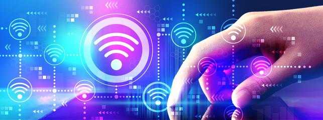 Wall Mural - Wifi concept with hand pressing tablet computer screen