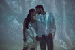 © LIGHTFIELD STUDIOS - two people standing in darkness and holding hands