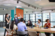 © feeling lucky - meeting of multiethnic business people brainstroming in modern business with city view background.
