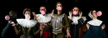 Young People As A Medieval Grandee On Dark Studio Background. Bubbling Up Of Pink Gum. Collage Of Portraits In Retro Costume. Human Emotions, Comparison Of Eras And Facial Expressions Concept.
