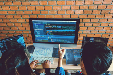 Developing programmer Team Development Website design and coding technologies working in software company office