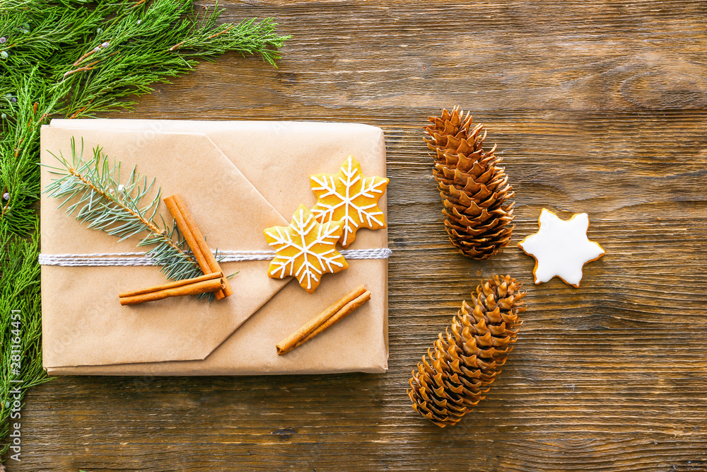 Beautiful Christmas composition with gift on wooden background