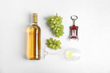 Wall Mural - Composition with wine and grape on white background, top view