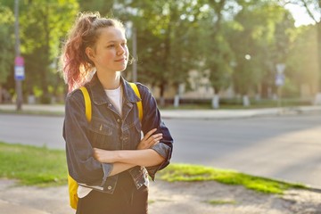 Wall Mural - Portrait of girl student 15 years old with backpack