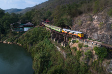 Drone Shot Of Death Railway Train On River Kwai Bridge At Kanchanaburi ,Thailand 
