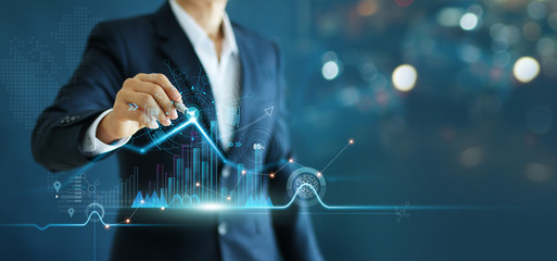 Businessman drawing growth graph chart sales and data economic on global structure networking connection.