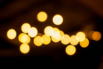 Wall Mural - Abstract blurred and bokeh of reflection lighting of light bubs in the night time background.