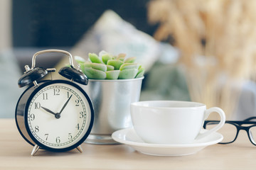 Wall Mural - Morning sun. Alarm clock on a beautiful background