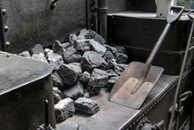 Interior Of Old Vintage Steam Locomotive Cabin. A Coal With Shovel In A Coal Tender In Steam Locomotive.