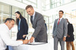 © wavebreak3 - Group of diverse business people waiting in line for registering