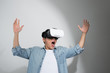 © makistock - Happy man getting experience using VR headset glasses of virtual reality, isolated on white background