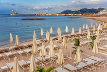 Sea Bay With Yachts Boats And Beach Umbrella In Cannes