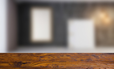 Empty interior with large window. Retro light bulb. The floor is of brown parquet.  3D rendering. wooden table. blurred background