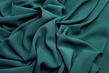 Wall Mural - The texture of the silk fabric is dark green. Background, pattern.