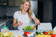 © speed300 - Happy woman mixing a salad.- Concept healthy food