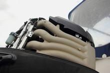 Modern Boat Outboard Motor With Open Hood Against The Sky And Boat Awning, Outdoor Repair And Maintenance Of Water Equipment