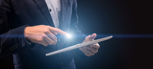 Poster - Man with lightng finger touching tablet screen to scroll
