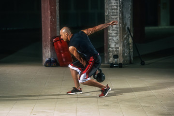 Strong Muscular Men Exercise With Kettlebell