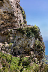 Wall Mural - POSITANO, ITALY - APRIL 25, 2018 : Unknown  young couple on the hiking trail 