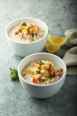 Canvas Print - Homemade chowder soup in white bowls