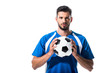 © LIGHTFIELD STUDIOS - handsome soccer player with ball looking at camera Isolated On White