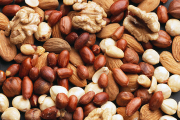 Wall Mural - Organic mixed nuts as background, top view