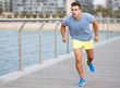 © JackF - Man listening music on workout