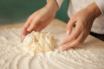 Making dough by female hands at home