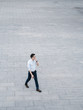 © JIACHUAN LIU/Stocksy - Chinese business man walking
