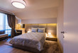 © Aleksandar Novoselski/Stocksy - Cozy bedroom in contemporary interior