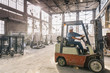 © Raymond Forbes LLC/Stocksy - Forklift Driver at Warehouse