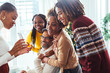 © Bonninstudio/Stocksy - Christmas family at home.