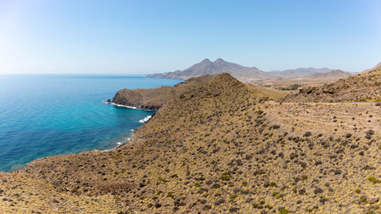 Wall Mural - The beautiful coastline in the Cabo de Gata Natural Park in southern Spain near the Andalusian city of Almeria. A panoramic view over the coast to the south.