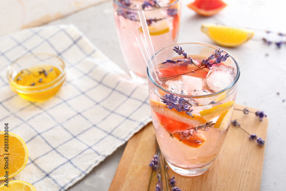 Glass with lavender lemonade on table