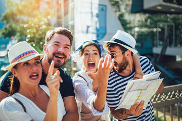 Happy group of tourists traveling and sightseeing together