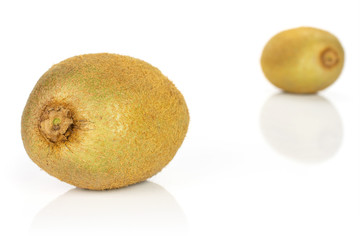 Group of two whole fresh green kiwifruit actinidia deliciosa one is in the front isolated on white background