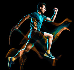 Wall Mural - one caucasian runner running jogger jogging man light painting speed effect isolated on black backgr