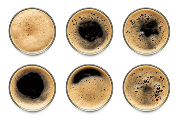 Glass of dark stout beer with foam assortment top view collection isolated on white background.