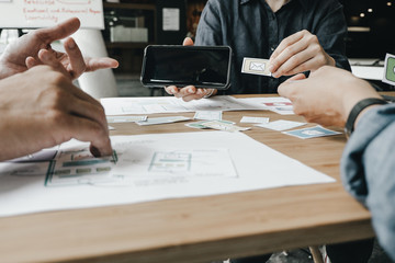 Graphic designers work together with computer designing application for mobile phone, Graphic designers concept