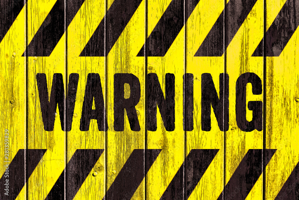 WARNING danger sign word text as stencil with yellow and black stripes ...