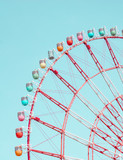 Fototapeta Tęcza - Retro colorful ferris wheel of the amusement park in the blue sky  background.