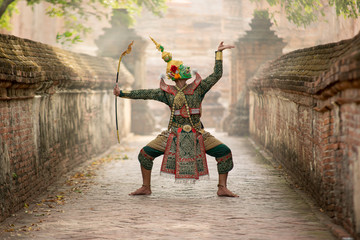 Wall Mural - Art culture Thailand Dancing in masked khon(Mime) in literature ramayana,Tos-Sa-Kan is character in thailand,A mime or mime artist is a person who uses mime as a performance art.