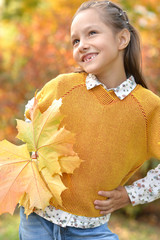 Sticker - Cute little girl smiling in autumnal park