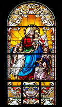 Virgin Mary With Baby Jesus And Angels, Stained Glass Window In The Saint John The Baptist Church In Zagreb, Croatia
