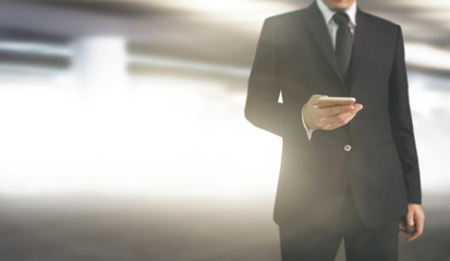  Business man using smartphone in hand