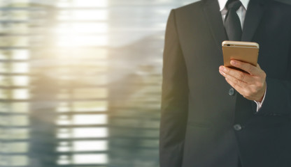  Business man using smartphone in hand