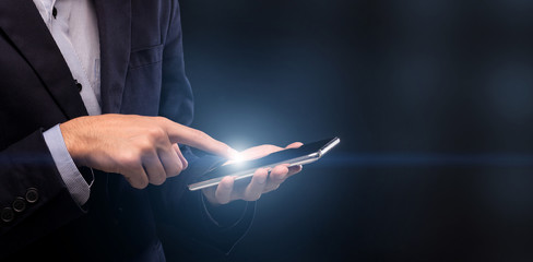Poster - Businessman holding out finger to light on cellphone screen