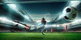 Fototapeta Sport - Female Soccer Goalkeeper catch the ball on a professional soccer stadium. Girls playing soccer