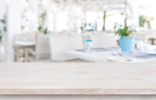 Defocused Resort Restaurant Background With Wooden Table Top In Front