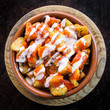Spanish potatoes patatas bravas for tapas with tomato and spicy sauce